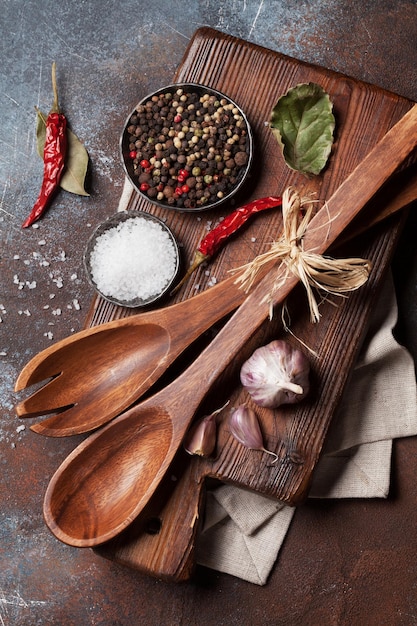 Wooden spoons and spices on table